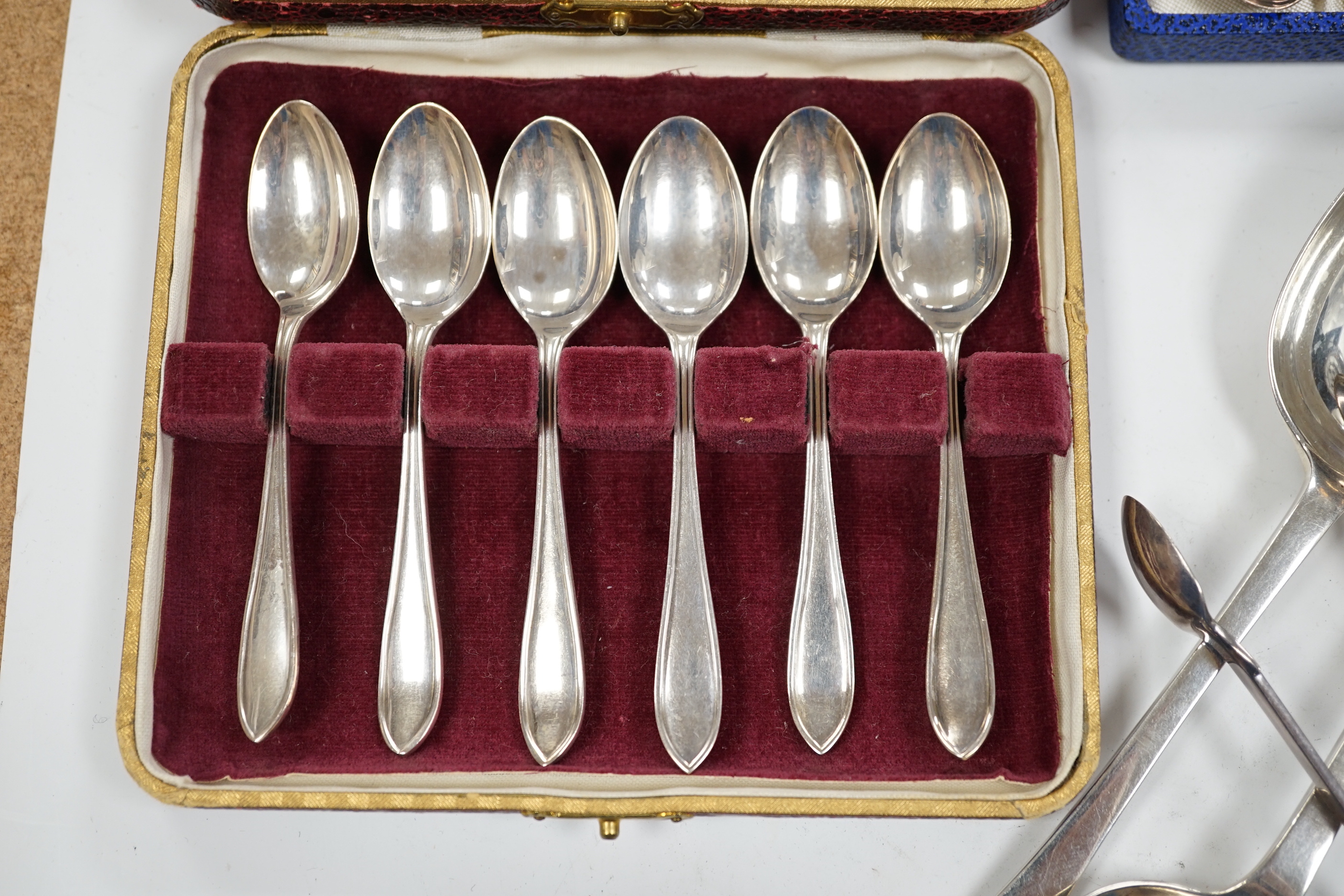 A pair of George V silver rat tail trefid spoons, Goldsmiths & Silversmiths Co Ltd, London, 1911, 20.2cm, three cased sets of silver coffee spoons and other silver flatware